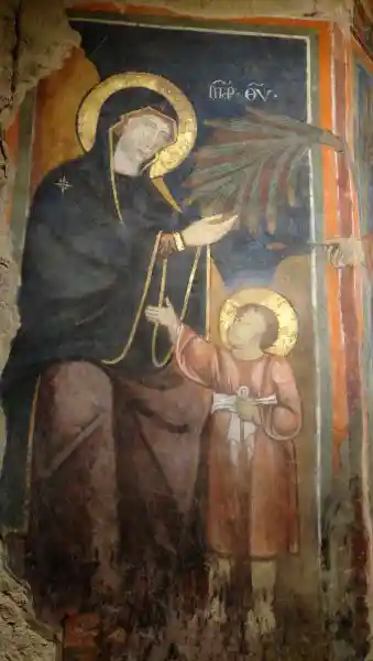 Mother and child painting, disc on their heads, solar disc